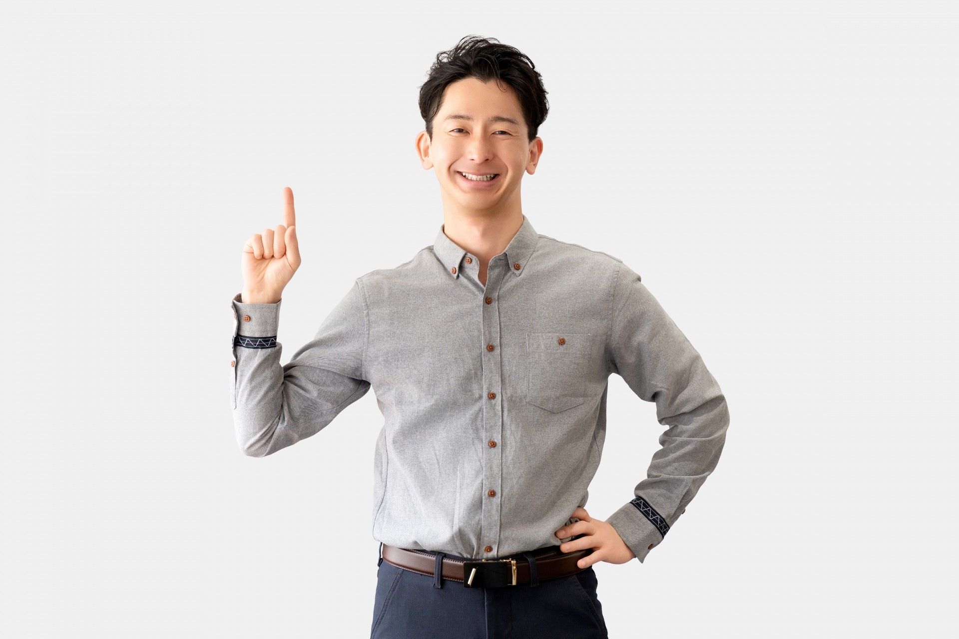 人差し指を立てて案内する男性ビジネスマン
