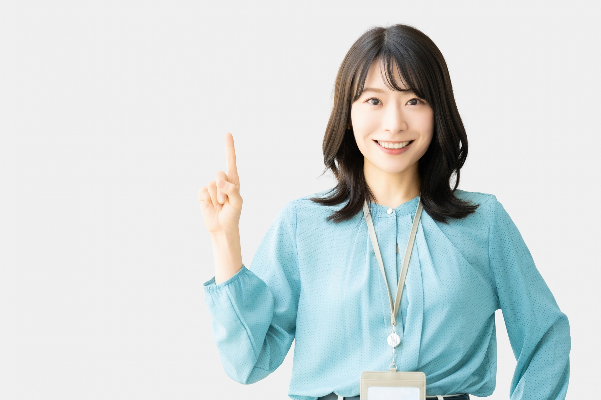 人差し指を立てている女性